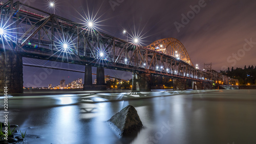 Patullo Bridge, Surrey, British Columbia, Canada. Long exposure of the bridge over the water. Sky Train Bridge. photo