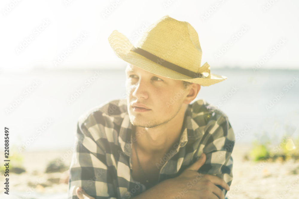 close up portarit of young man relax and enjoy on the ocean beach a lifestyle casual