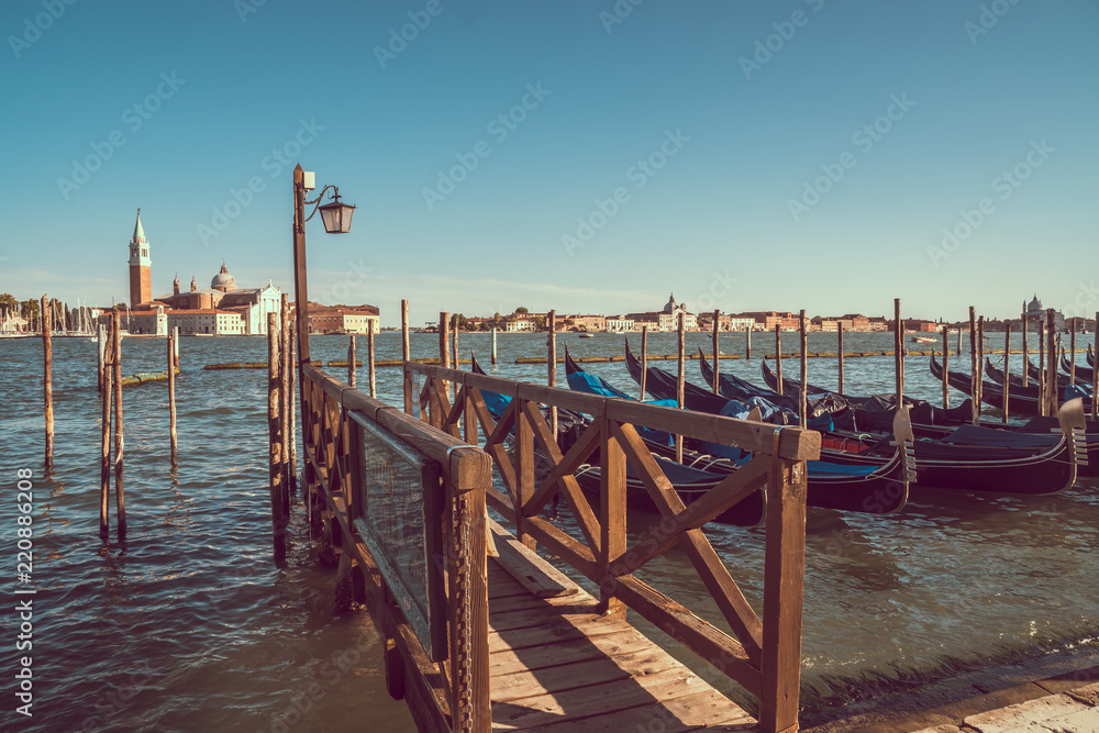 view of gondolas and San Giorgio church as background in Venice, Italy view of gondolas and San Giorgio church as background in Venice, Italy