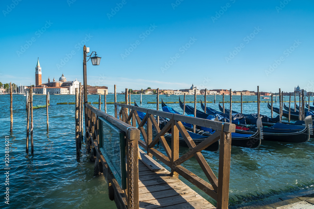view of gondolas and San Giorgio church as background in Venice, Italy view of gondolas and San Giorgio church as background in Venice, Italy