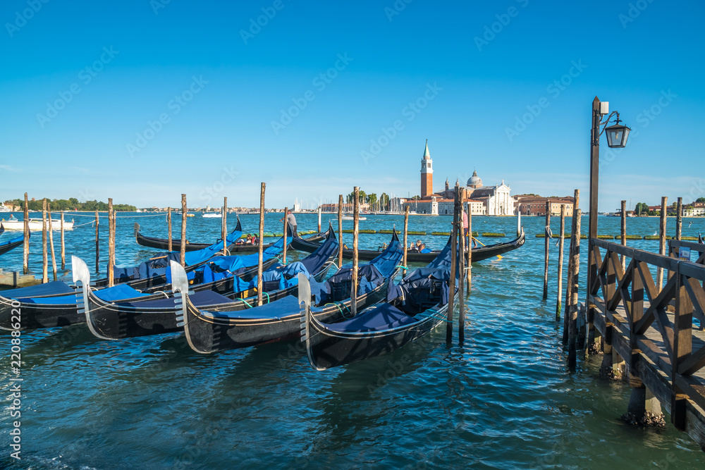 view of gondolas and San Giorgio church as background in Venice, Italy
