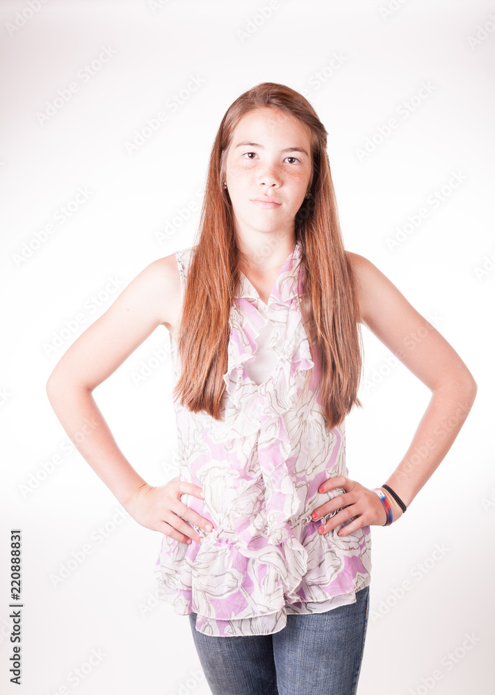 Cute Tween Brunette girl in studio with hand on hips Cute Tween Brunette girl in studio with hand on hips