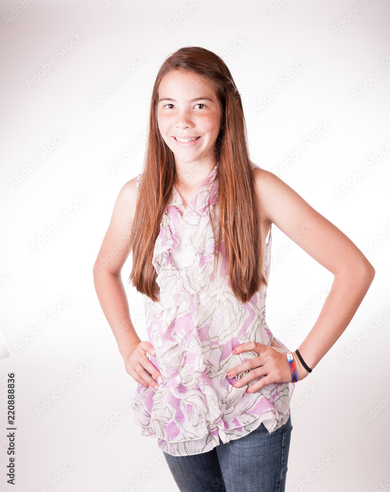 Cute Tween Brunette girl in studio with hand on hips Cute Tween Brunette girl in studio with hand on hips