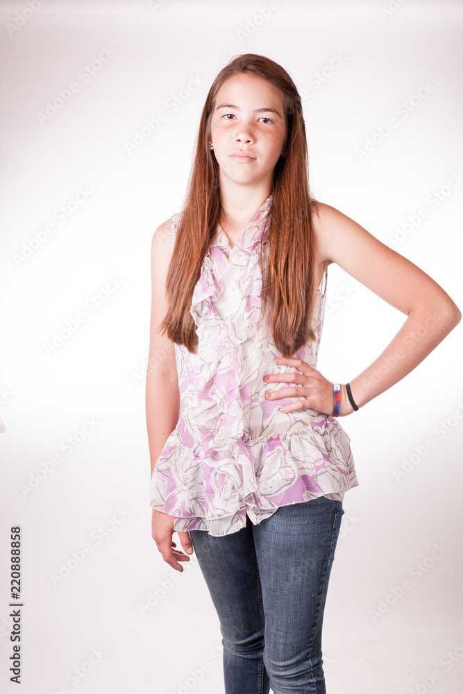 Cute Tween Brunette girl in studio with hand on hips Cute Tween Brunette girl in studio with hand on hips