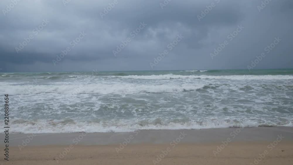 Beautiful sand beach with soft wave in sea water , cloudy rainy sky. Beautiful sand beach with soft wave in sea water , cloudy rainy sky.