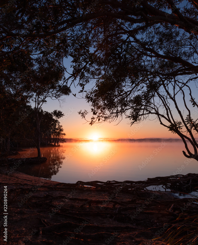 Sun peeking over Noosa Lake Sun peeking over Noosa Lake