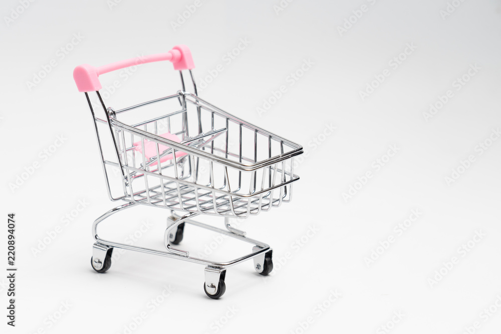 Close up of supermarket grocery push cart for shopping with black wheels on white background. Concept of shopping. Close up of supermarket grocery push cart for shopping with black wheels on white background. Concept of shopping.