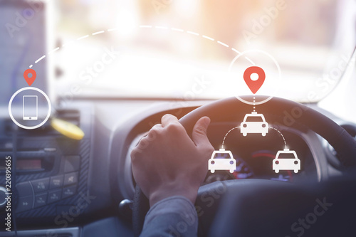 Public Taxi,gps,call taxi,location searching  concept. An unidentified man is driving public taxi.