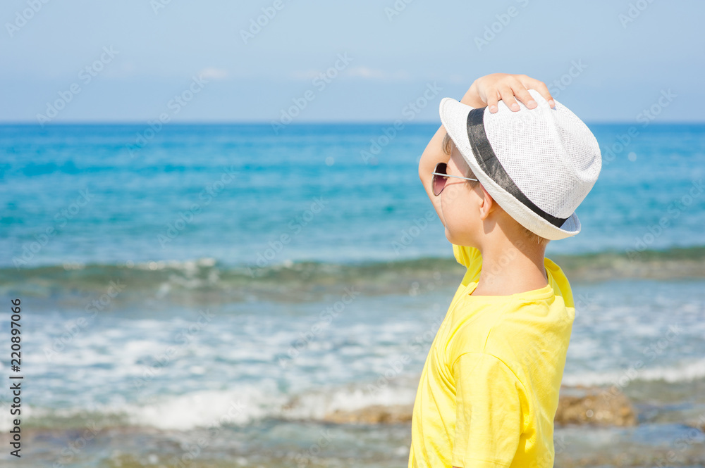 Little boy enjoying on the beach. Space for text