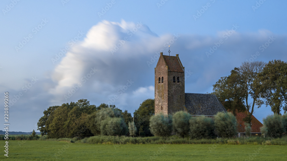Church with tower in hamlet