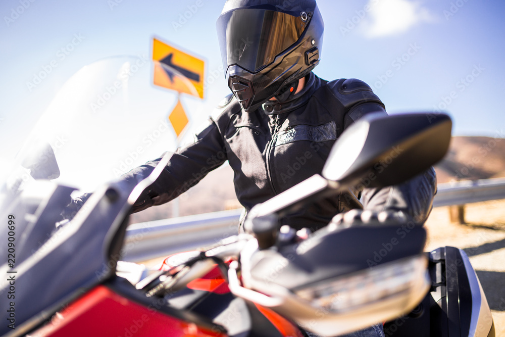 Naklejka premium Motorcycle Rider On His Bike On A Sunny Day
