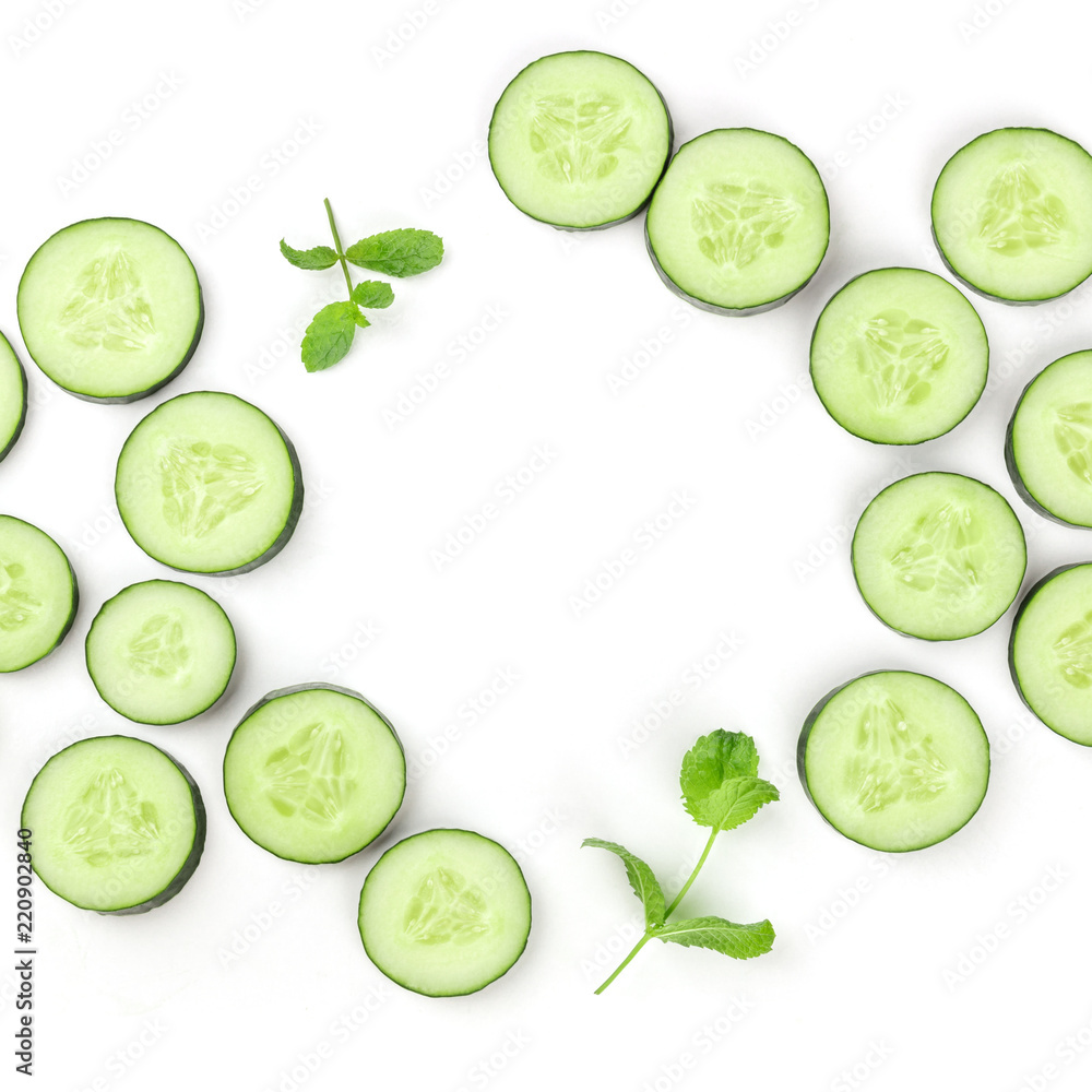 Sliced cucumber and mint background with copyspace Sliced cucumber and mint background with copyspace