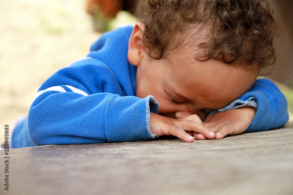 poverty boy crying stock photo