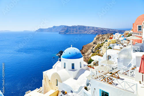 white houses with blue roofs on Santorini