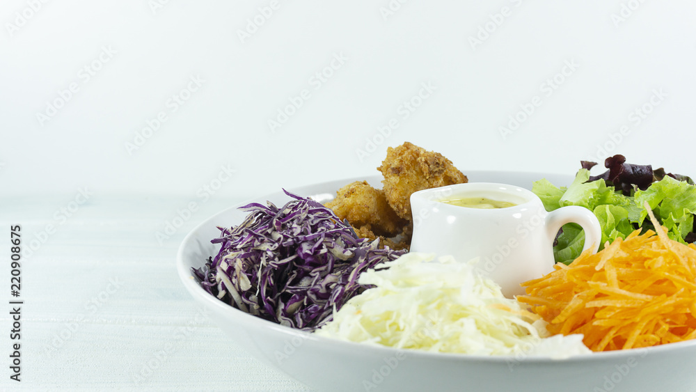 Healthy salad diet food concept, props decoration green and Purple Salad in white Plate on wood floor background, Close up, with copy space for your text. Healthy salad diet food concept, props decoration green and Purple Salad in white Plate on wood floor background, Close up, with copy space for your text.