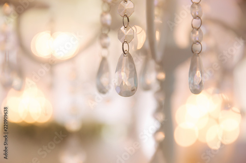 Bokeh of wedding chandelier. Shine of lights