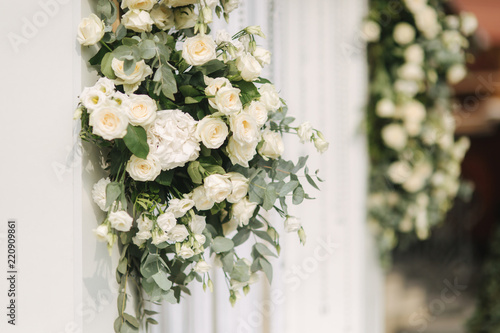 Arch decorated with flowers at the wedding caremony photo