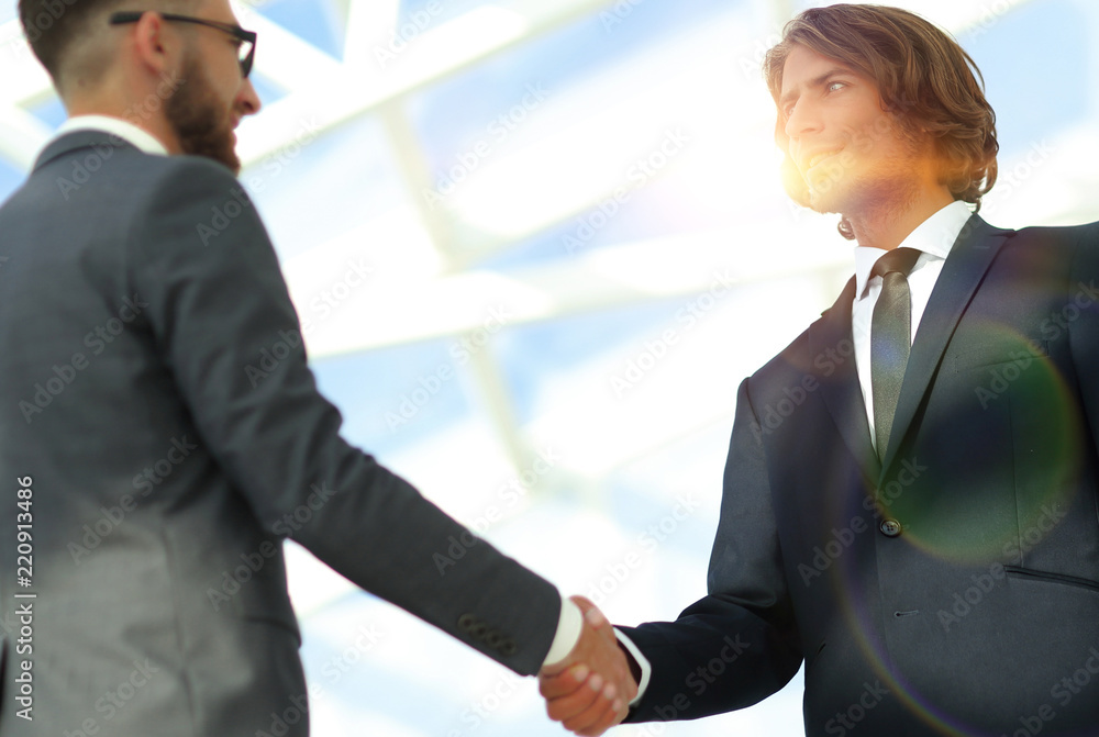 Business handshake and business people. Business handshake and business people.