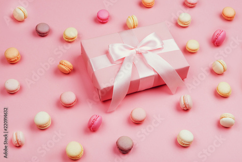 Gift box and macarons on pink background © Margo Basarab