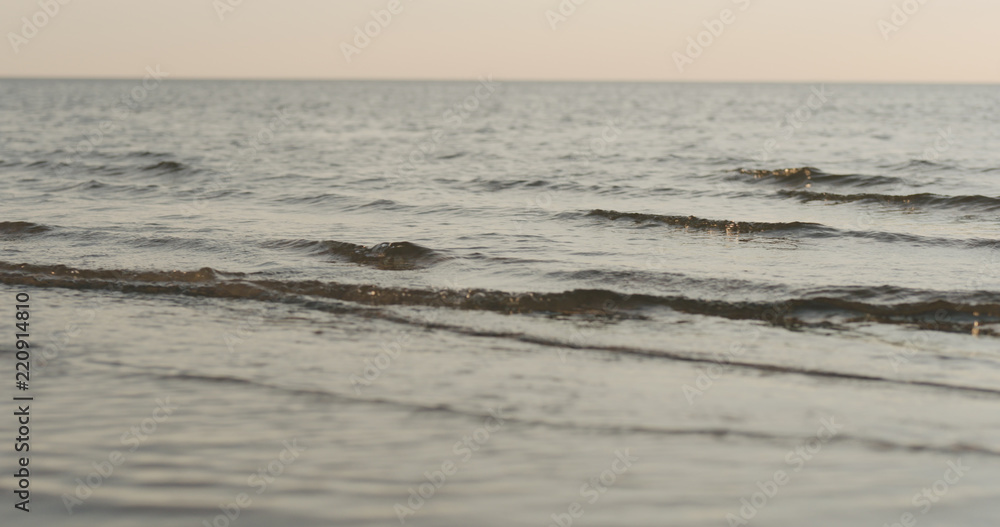 waves on a beach on a windy sunny day waves on a beach on a windy sunny day