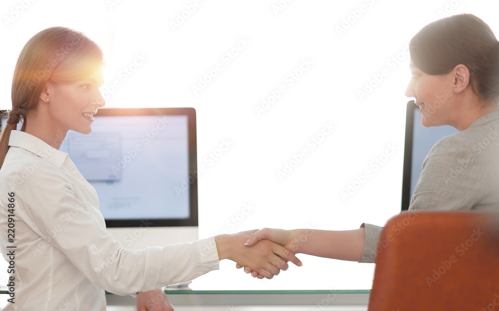 background image. business woman stretches out hand for a handshake. background image. business woman stretches out hand for a handshake.