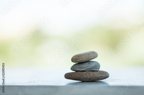Stones on white background outdoors with sunlight