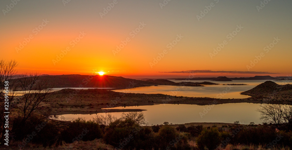 Sunrise over the Gariep Dam in the Karoo natural region in South Africa image in landscape format with copy space