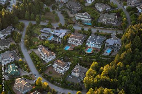 Aerial view of the big luxury homes on the hill during a vibrant sunny summer day. Taken in West Vancouver, British Columbia, Canada.