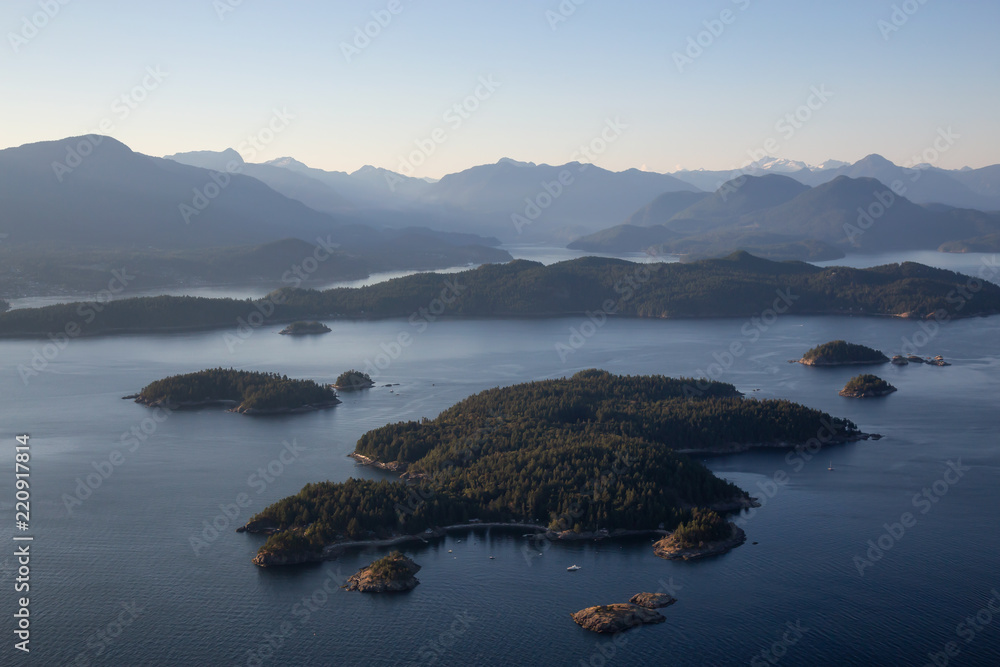 Aerial view of rocky Islands in Howe Sound during a sunny summer evening. Located near Vancouver, BC, Canada.