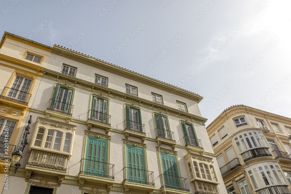 Architecture and buildings from XIX century in Larios Street, in Malaga, Spain.