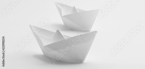 two white boat , made in the technique of origami