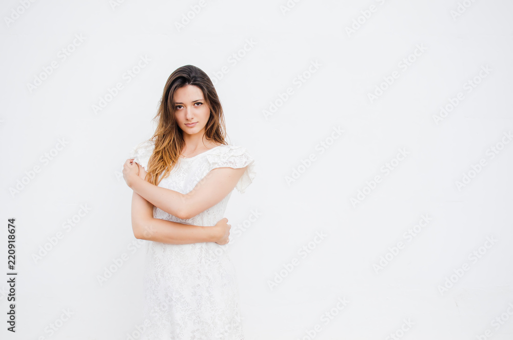 Woman in white dress with long hair, white background. Woman in white dress with long hair, white background.