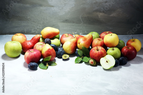 Fototapeta Naklejka Na Ścianę i Meble -  Various fresh fruits. Thanksgiving apples, and pears on rustic background.