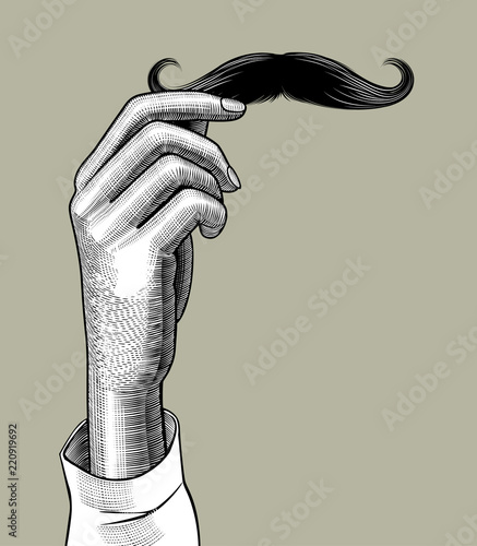 Female hand holding a male mustache