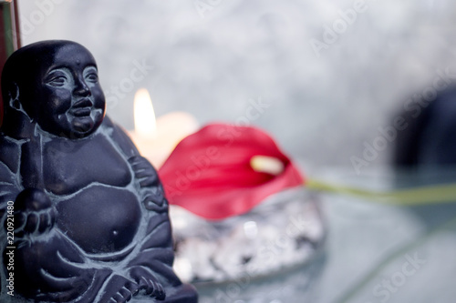 Generic buddha decoration with candle and flower