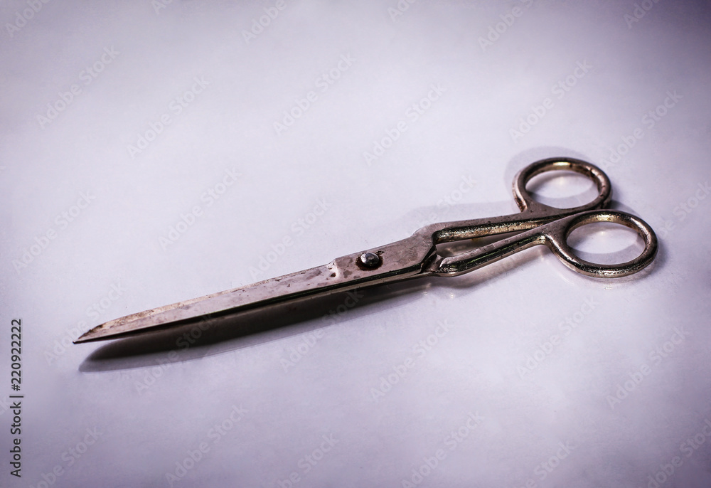 scissors made of metal.isolated on a light background. scissors made of metal.isolated on a light background.