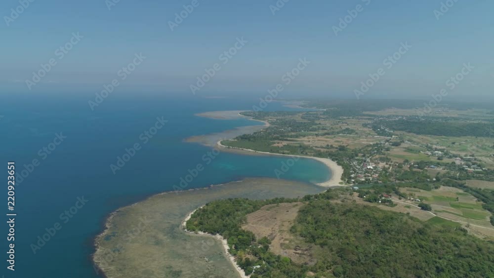 Aerial view of seashore with beaches, lagoons and coral reefs. Philippines, Luzon. Coast ocean with turquoise water. Tropical landscape in Asia. Aerial view of seashore with beaches, lagoons and coral reefs. Philippines, Luzon. Coast ocean with turquoise water. Tropical landscape in Asia.