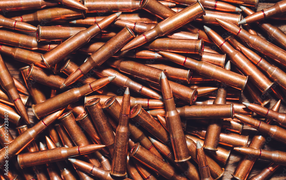 Bullets on wooden background. Bullets on wooden background.