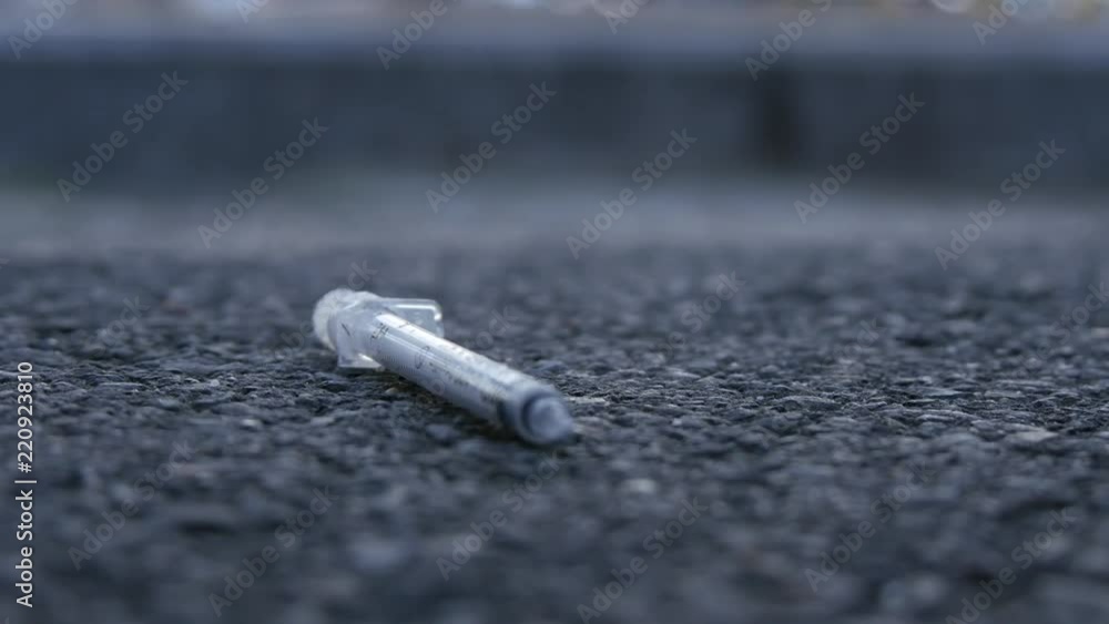 Close Up Shoot with Injection Instrument Used in Medicine Left on the Street Close Up Shoot with Injection Instrument Used in Medicine Left on the Street