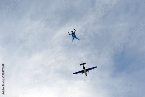 Skydiving. Girl is in the sky.