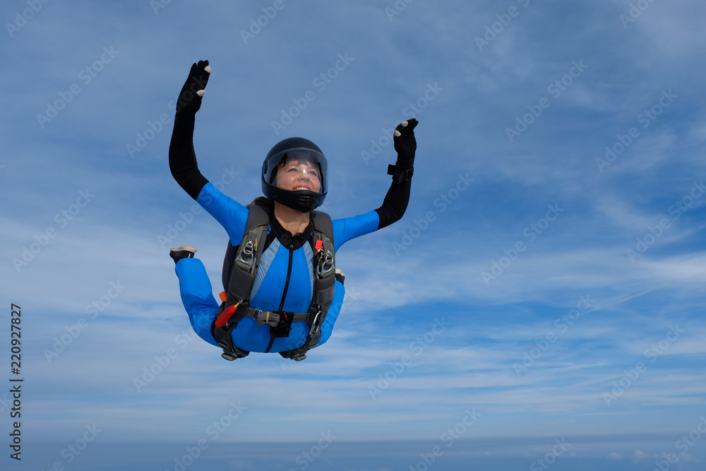 Obraz premium Skydiving. Girl is in the sky.