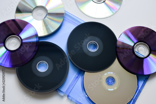 Blu-ray disc in the blue box on white background. Top view