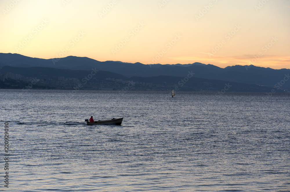 Before sunrise on the beach, early morning seaside activity Before sunrise on the beach, early morning seaside activity