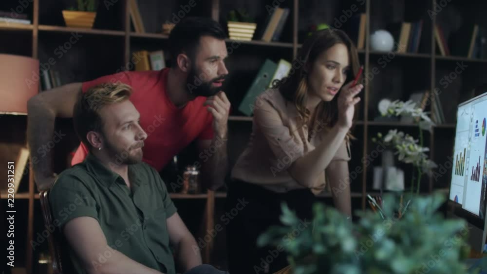 Business analyst team looking diagrams on computer in office. Successful team enjoy good business statistic. Business team give high five hand. Marketing team business achievement concept