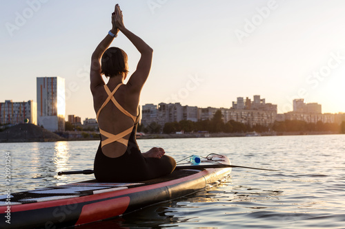 SUP Stand up paddle board woman paddle boarding