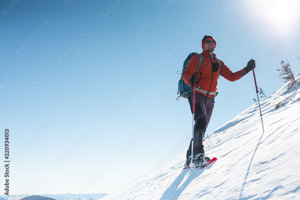 A man climbs to the top of the mountain. A man climbs to the top of the mountain.