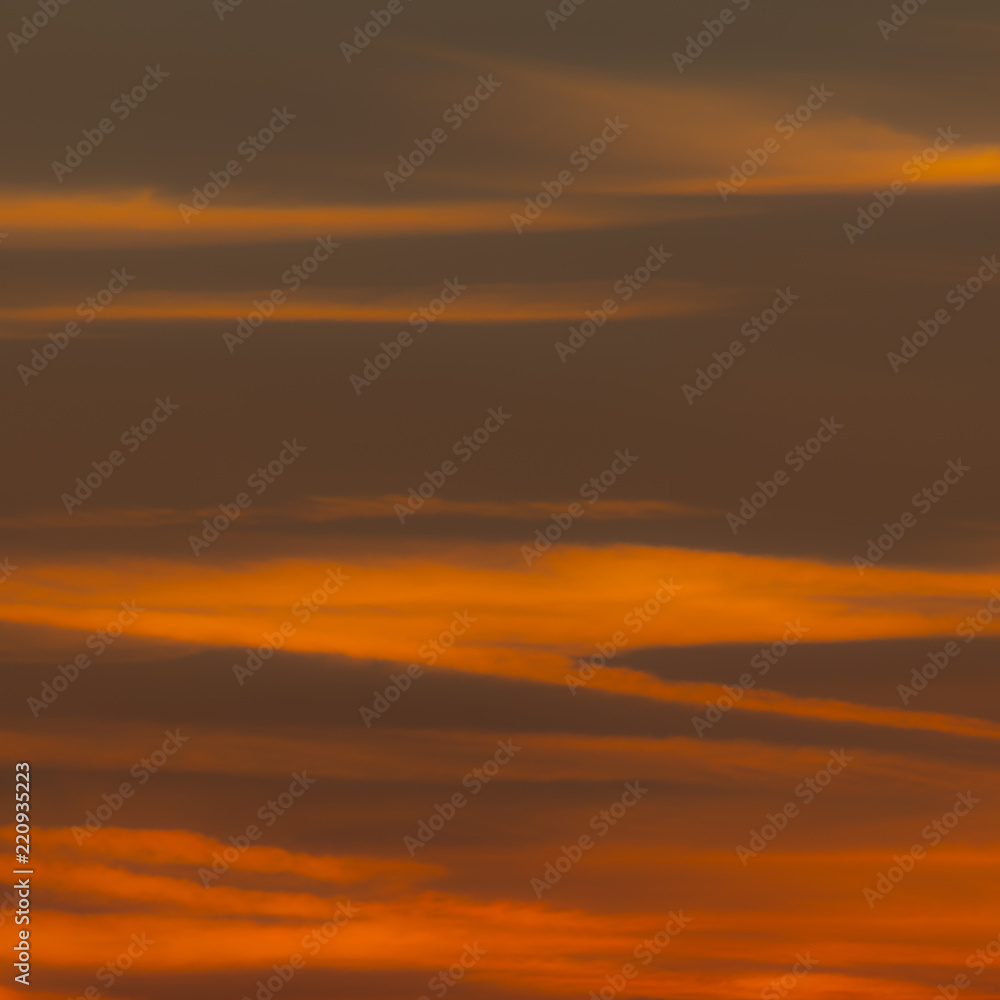 Squared image of beautiful sunset sky with clouds. Red, orange, pastel tone. Concept or background for passion, desire, heat, longing, lust, sexuality, sensitivity, romance, rage, anger, danger