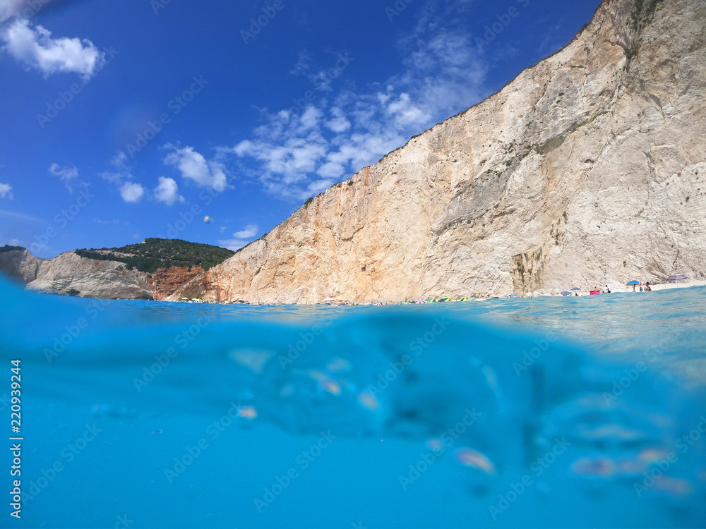 Fototapeta premium Sea level underwater photo of tropical caribbean paradise turquoise beach in exotic island located in an ocean