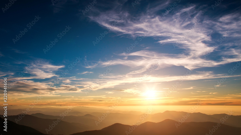 Silhouettes of mountains on background of sunset sky Silhouettes of mountains on background of sunset sky