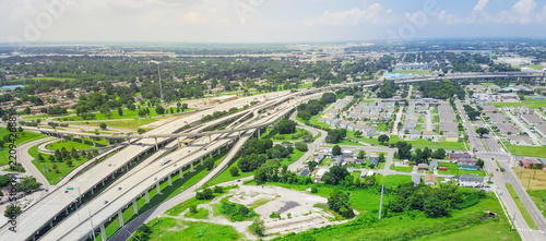 Panorama aerial view highway 90 (U.S. Route 90, US-90) and elevated Westbank expressway in suburban New Orleans, Louisiana. Massive intersection, stack interchange, road junction overpass with traffic photo